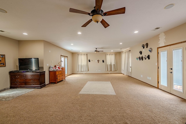 5016 Frontier Rd NE, Rio Rancho, NM 87144 - living area featuring visible vents, light colored carpet, and ceiling fan