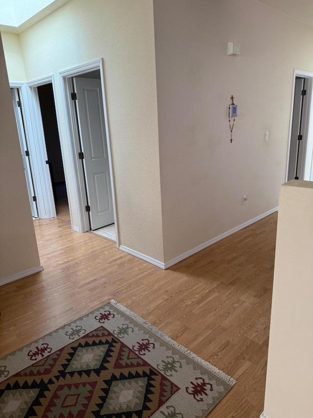 4449 Sunflower Ct SE, Rio Rancho, NM 87124 - unfurnished room featuring light wood-style floors, baseboards, and a skylight