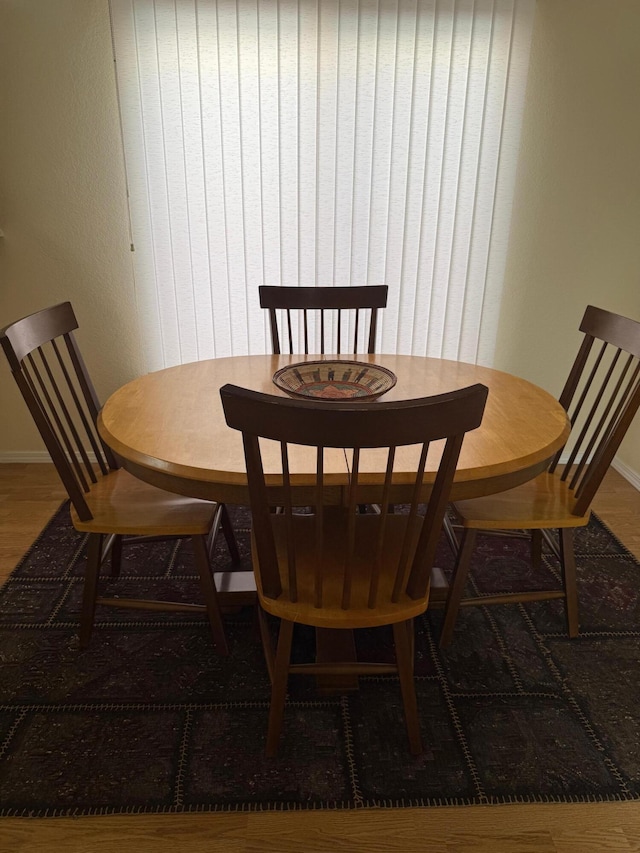 4449 Sunflower Ct SE, Rio Rancho, NM 87124 - dining space featuring baseboards and wood finished floors