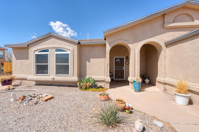 2028 Clearwater Loop NE, Rio Rancho, NM 87144 - property entrance featuring stucco siding