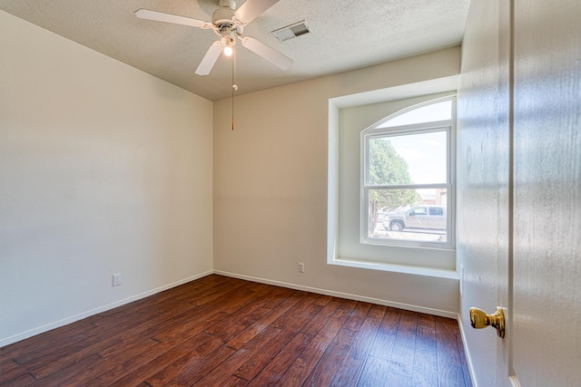2028 Clearwater Loop NE, Rio Rancho, NM 87144 - spare room with dark wood-style flooring, baseboards, ceiling fan, and a textured ceiling