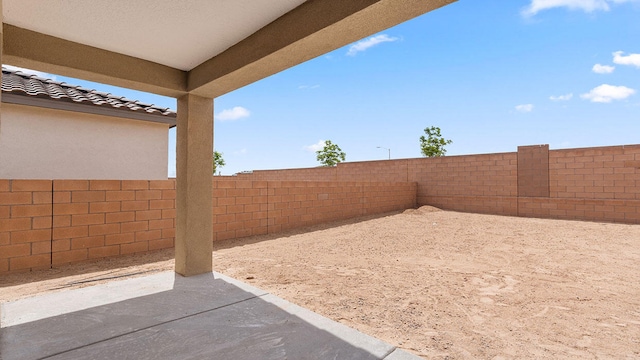view of yard with a patio area and a fenced backyard