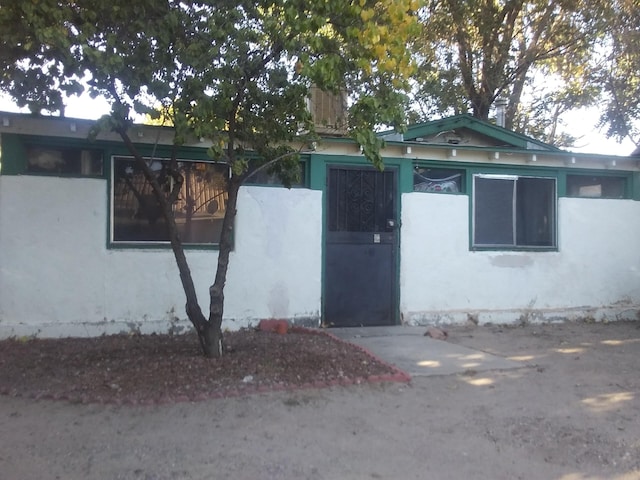 exterior space with stucco siding