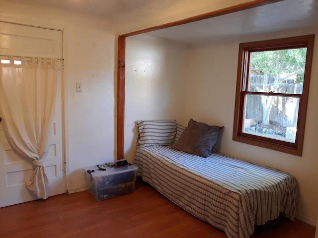 bedroom with wood finished floors