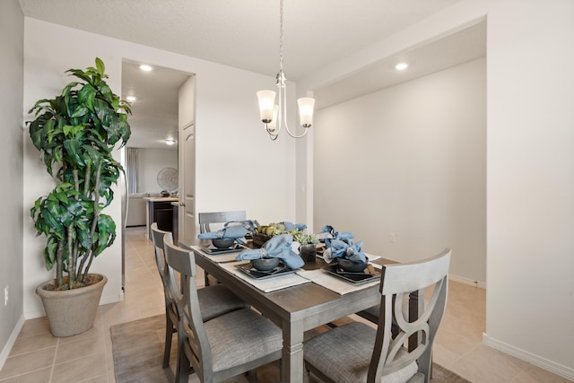 dining space with recessed lighting, a chandelier, baseboards, and light tile patterned floors
