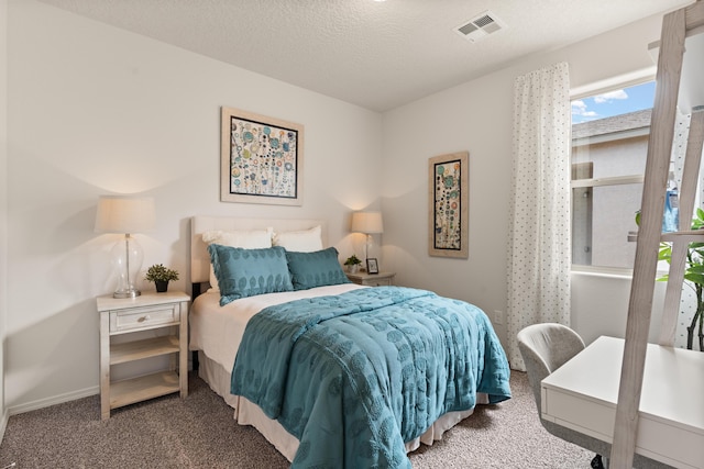 carpeted bedroom with baseboards and visible vents