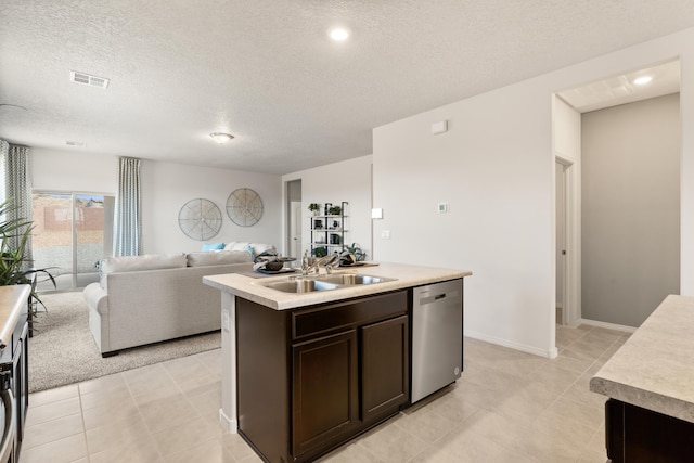 kitchen with dark brown cabinets, a sink, a textured ceiling, dishwasher, and visible vents