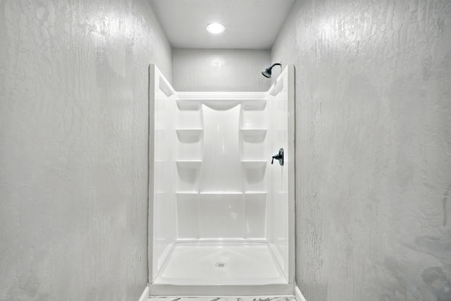 bathroom featuring a stall shower