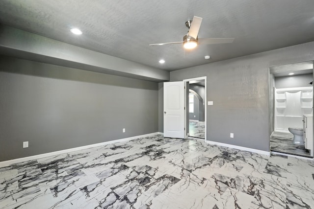 unfurnished bedroom with marble finish floor, baseboards, a ceiling fan, and recessed lighting
