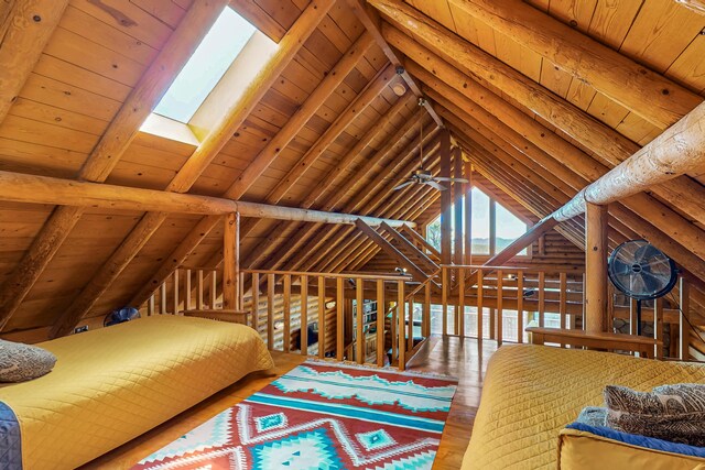 387 County Rd B64, Pecos, NM 87552 - bedroom featuring wood ceiling, a skylight, and wood finished floors