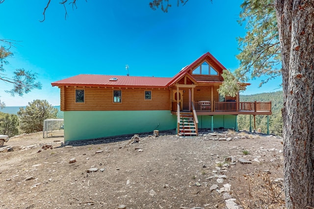 387 County Rd B64, Pecos, NM 87552 - log-style house featuring log exterior, stairway, a wooden deck, and metal roof