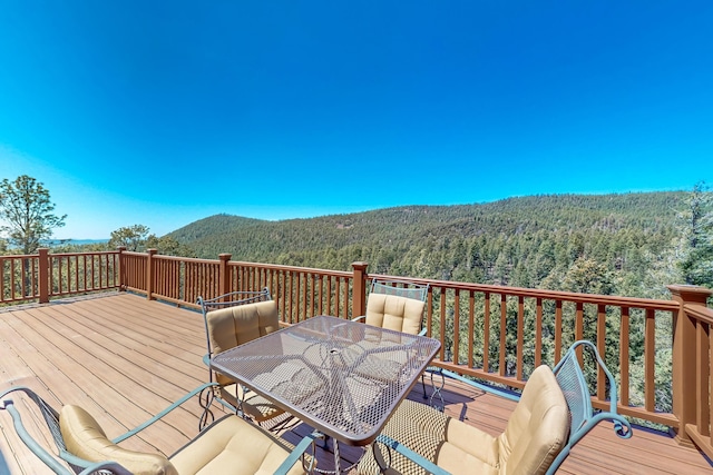 387 County Rd B64, Pecos, NM 87552 - wooden terrace with a wooded view and a mountain view