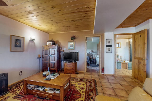 387 County Rd B64, Pecos, NM 87552 - living room with wood ceiling, light tile patterned floors, and baseboards