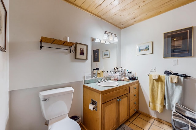 387 County Rd B64, Pecos, NM 87552 - bathroom with tile patterned floors, wooden ceiling, toilet, and vanity
