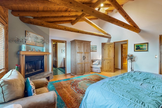 387 County Rd B64, Pecos, NM 87552 - bedroom featuring light wood-type flooring, wood ceiling, and a fireplace with raised hearth