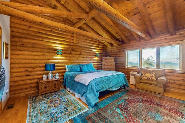 387 County Rd B64, Pecos, NM 87552 - bedroom with wood ceiling, log walls, and hardwood / wood-style flooring