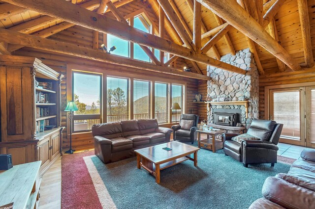 387 County Rd B64, Pecos, NM 87552 - living room with wood ceiling, high vaulted ceiling, plenty of natural light, beamed ceiling, and rustic walls