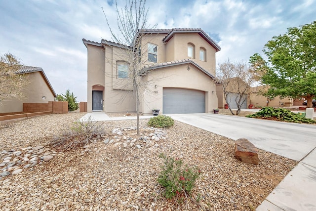 7105 Napoleon Rd NE, Rio Rancho, NM 87144 - mediterranean / spanish-style house featuring an attached garage, stucco siding, fence, concrete driveway, and a tiled roof