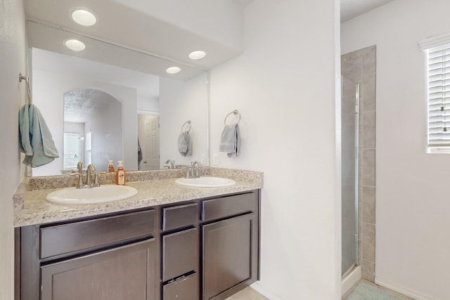 7105 Napoleon Rd NE, Rio Rancho, NM 87144 - bathroom featuring a stall shower and double vanity