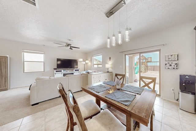 7105 Napoleon Rd NE, Rio Rancho, NM 87144 - dining room featuring light tile patterned floors, a ceiling fan, a textured ceiling, and baseboards
