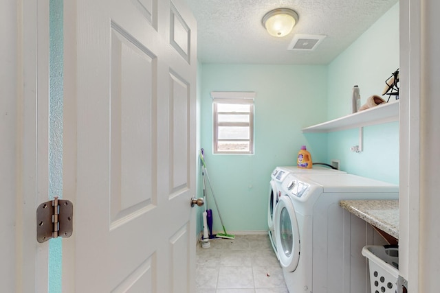 7105 Napoleon Rd NE, Rio Rancho, NM 87144 - washroom with washer and dryer, a textured ceiling, and baseboards