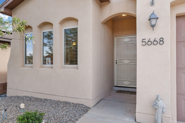5668 Cold Creek Ave NW, Albuquerque, NM 87114 - view of exterior entry with stucco siding