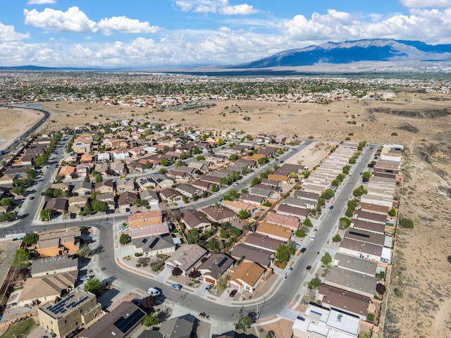 5668 Cold Creek Ave NW, Albuquerque, NM 87114 - aerial view of property and surrounding area with mountains and nearby suburban area