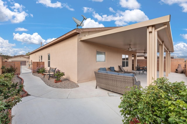 5668 Cold Creek Ave NW, Albuquerque, NM 87114 - view of patio featuring ceiling fan, a gate, and an outdoor hangout area