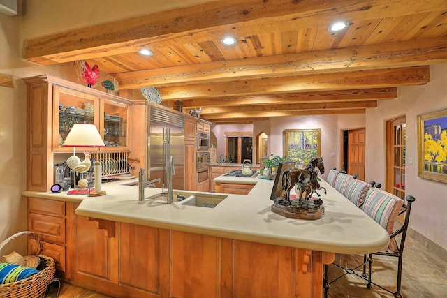 253 Spring Creek Pl NE, Albuquerque, NM 87122 - kitchen featuring stainless steel appliances, a breakfast bar, recessed lighting, light countertops, and a peninsula
