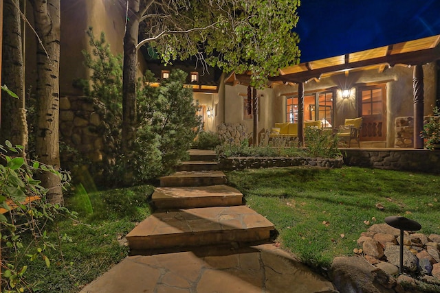 view of yard at twilight