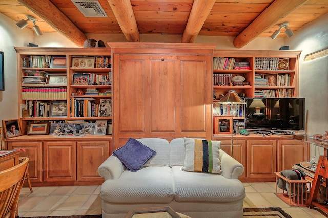living area with wooden ceiling, visible vents, beam ceiling, and light tile patterned floors
