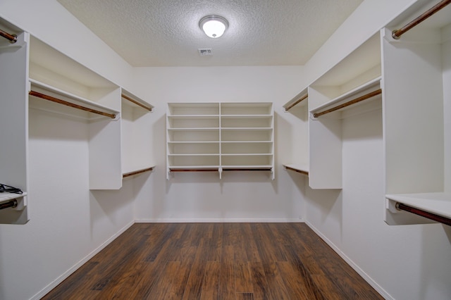 7227 Wasilla Dr NE, Rio Rancho, NM 87144 - spacious closet with visible vents and dark wood-type flooring