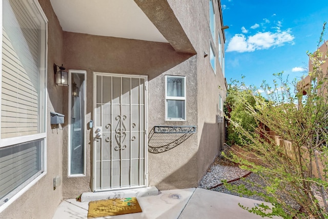 3404 Lockerbie Dr SE, Rio Rancho, NM 87124 - view of exterior entry with stucco siding