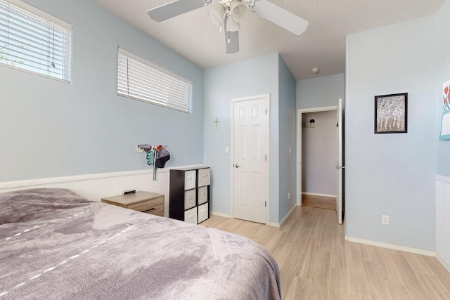 3404 Lockerbie Dr SE, Rio Rancho, NM 87124 - bedroom with ceiling fan and light wood-style floors