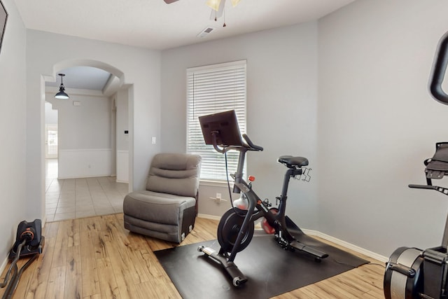 3404 Lockerbie Dr SE, Rio Rancho, NM 87124 - workout room with arched walkways, wood-type flooring, and a ceiling fan