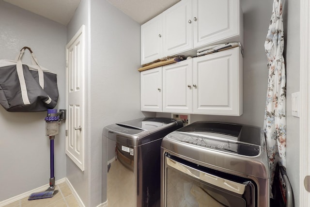 3404 Lockerbie Dr SE, Rio Rancho, NM 87124 - washroom with light tile patterned flooring, baseboards, independent washer and dryer, and cabinet space