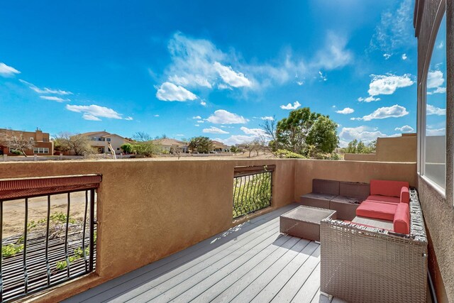 3404 Lockerbie Dr SE, Rio Rancho, NM 87124 - wooden terrace with outdoor lounge area
