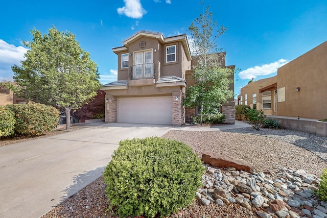 3404 Lockerbie Dr SE, Rio Rancho, NM 87124 - view of front of property featuring a tile roof, driveway, a garage, a balcony, and stucco siding