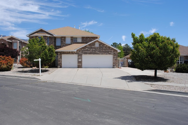 traditional-style home with a garage and driveway
