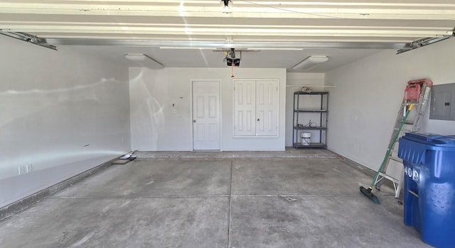 garage featuring electric panel and a garage door opener