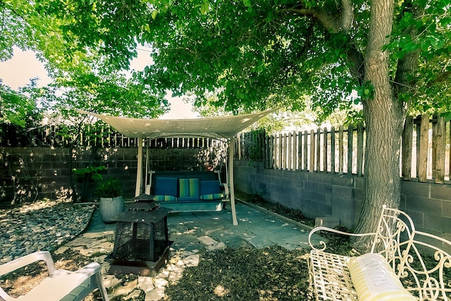 view of yard with a fenced backyard and a patio