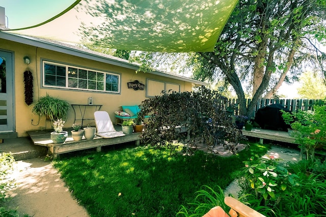 exterior space with a wooden deck and fence