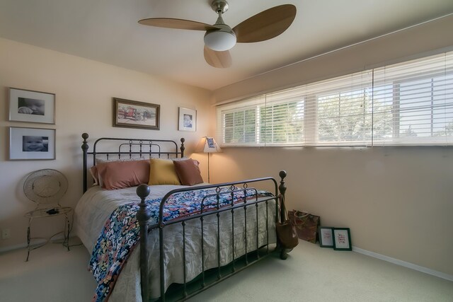 bedroom featuring baseboards, carpet flooring, and ceiling fan
