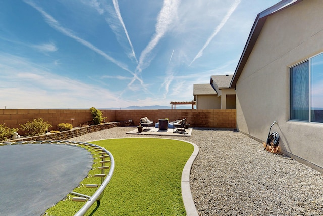 view of yard with a fenced backyard and a patio