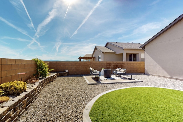 view of yard featuring a patio area and a fenced backyard