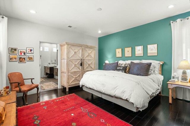 bedroom with visible vents, dark wood-style flooring, and recessed lighting