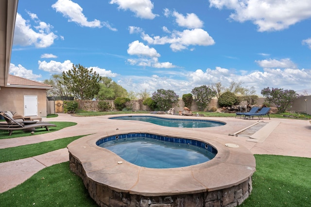 view of pool featuring a fenced in pool, a patio, a fenced backyard, and an in ground hot tub
