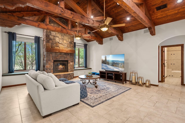living room with wood ceiling, plenty of natural light, and baseboards