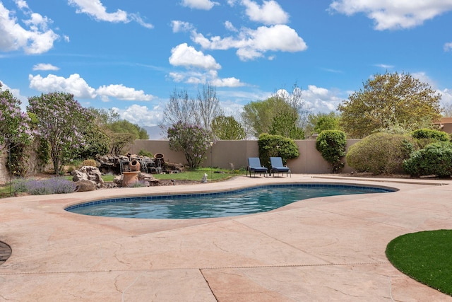 view of swimming pool with a patio area, a fenced backyard, and a fenced in pool
