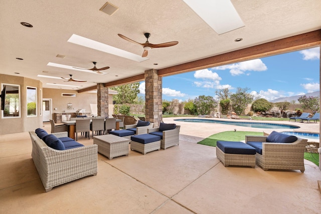 view of patio featuring a fenced in pool, visible vents, and ceiling fan